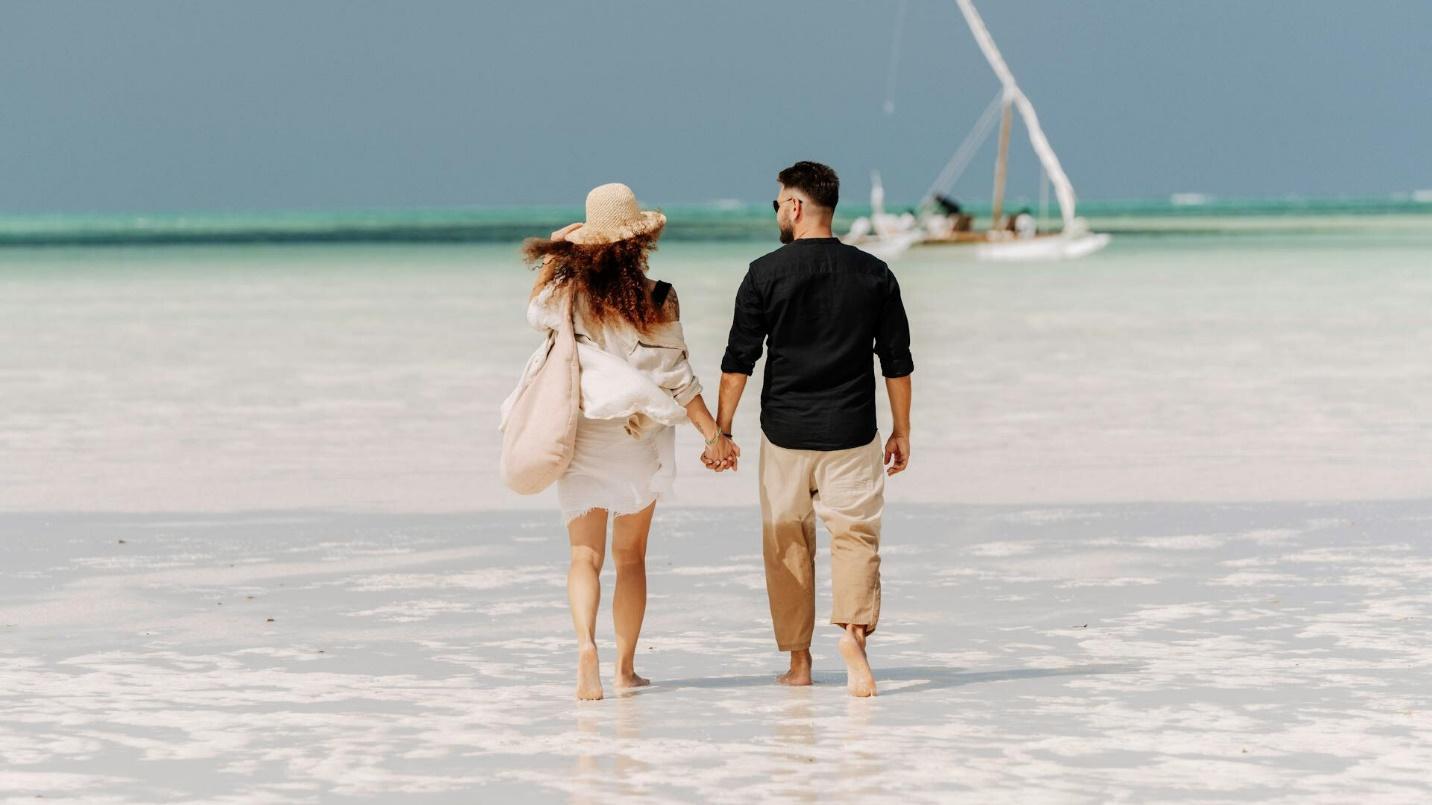 A couple taking a walk in the beach