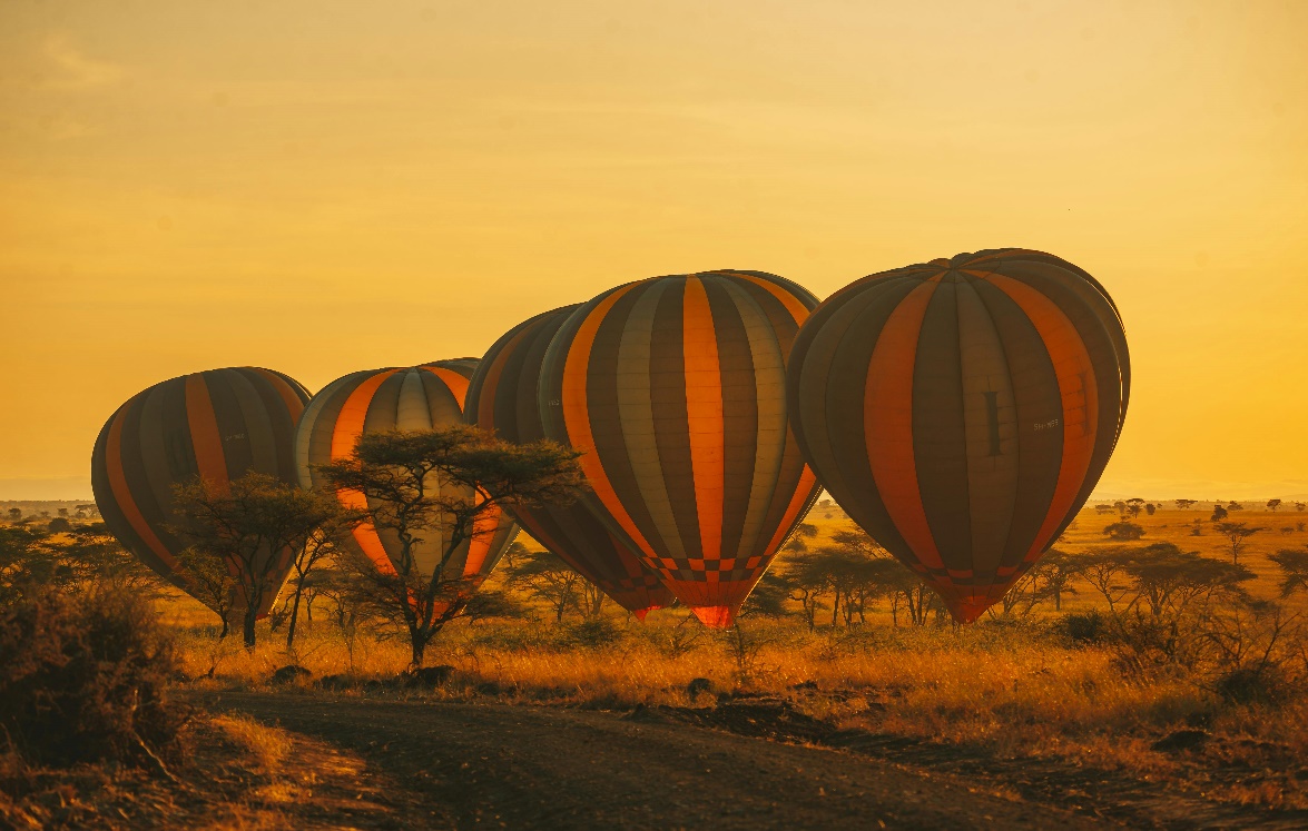 A stunning sunrise with the miracle hot air balloon safaris, Serengeti.