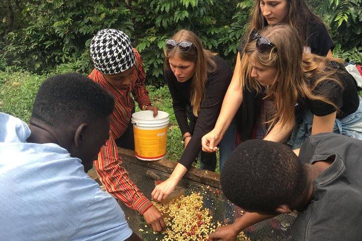 Tourists with locals at a cooking class.