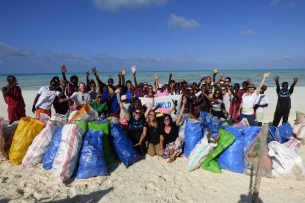 Locals and tourists mobilized by Elewana Collection participating in a beach clean-up, Zanzibar